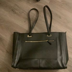 Black Lo & Sons Seville Prima leather tote bag.
